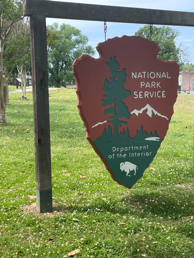 Wooden hanging National Park Service sign