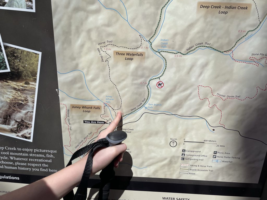 child pointing at trail map at Smoky Mountain National Park