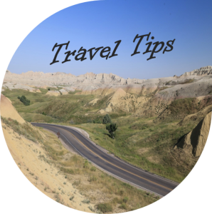 Words " Travel tips" over a picture of an empty road through the Badlands National Park.