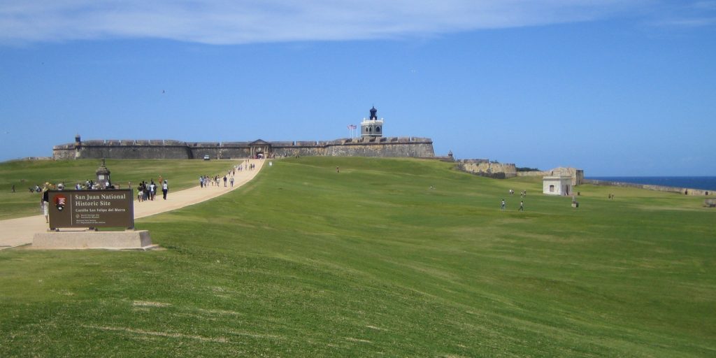 wide angle shot of Castillo San Felipe Del Morro National historic site in San Juan on clear blue sky