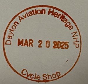 National Park passport including Dayton Aviation Heritage NHP Cycle shop stamp in red