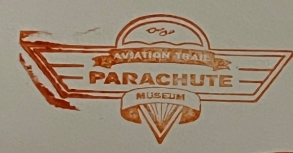 National Park passport stamp Aviation Trail Parachute Museum in red