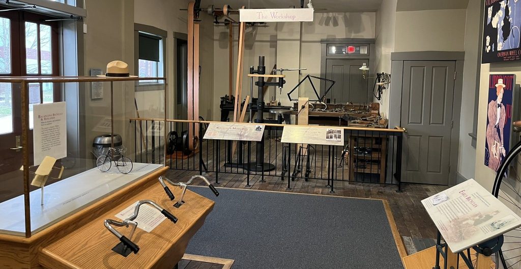 Wright Cycle Company interior showing authentic workshop setup with vintage bicycles and tools