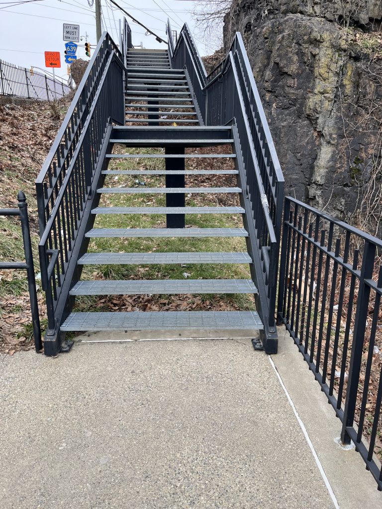 Metal staircase providing access between the lower falls viewing area and upper street level at Paterson Great Falls National Historical Park