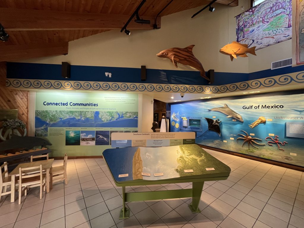 Gulf Islands National Seashore Visitor Center: Davis Bayou Guide 5 A small, museum-like exhibit area inside the Davis Bayou Area of the Gulf Islands National Seashore, with several displays and artifacts on the history and environment of the area.