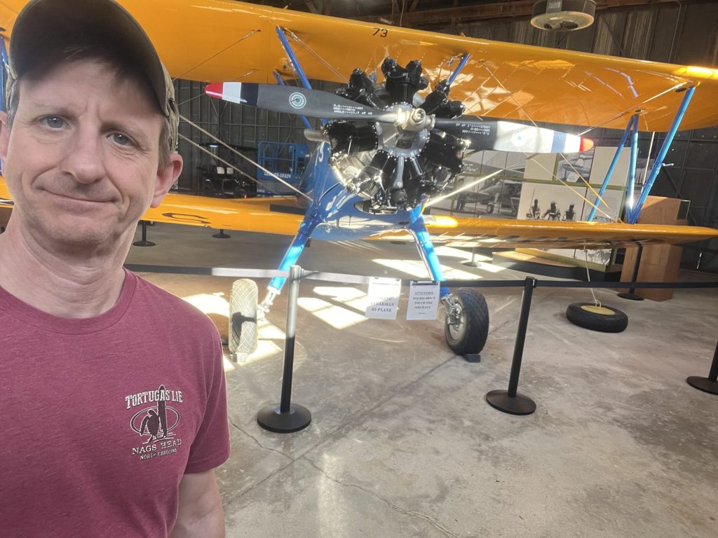 Selfie with the Stearman PT-17 biplane engine visible from above in Hangar 2 at Tuskegee NHS