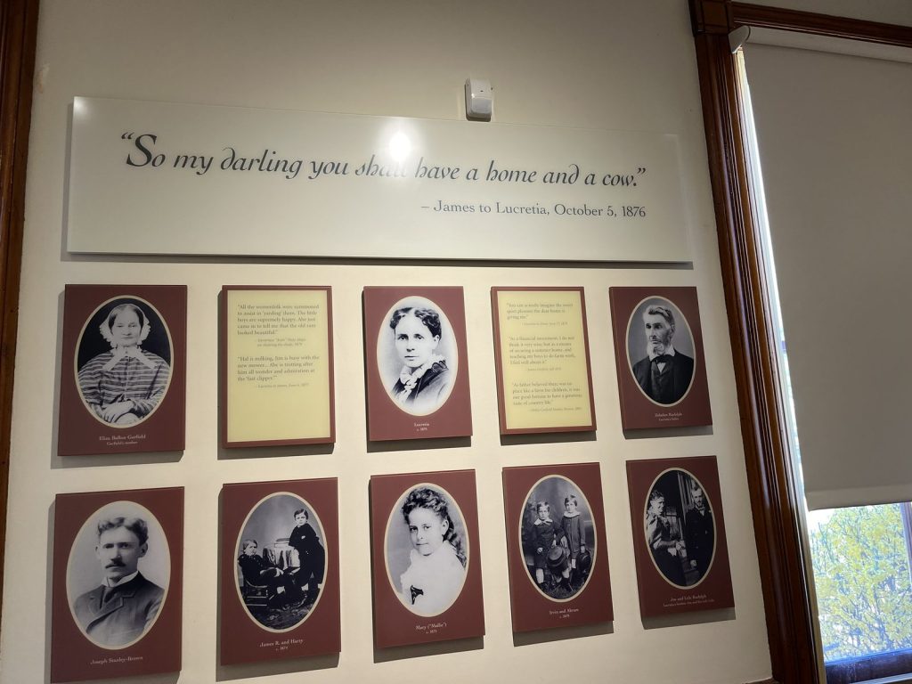 Garfield family photo display wall with quote at James A. Garfield National Historic Site visitor center