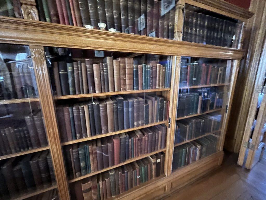 Glass-front bookcase inside the memorial library at Lawnfield James A. Garfield National Historic Site