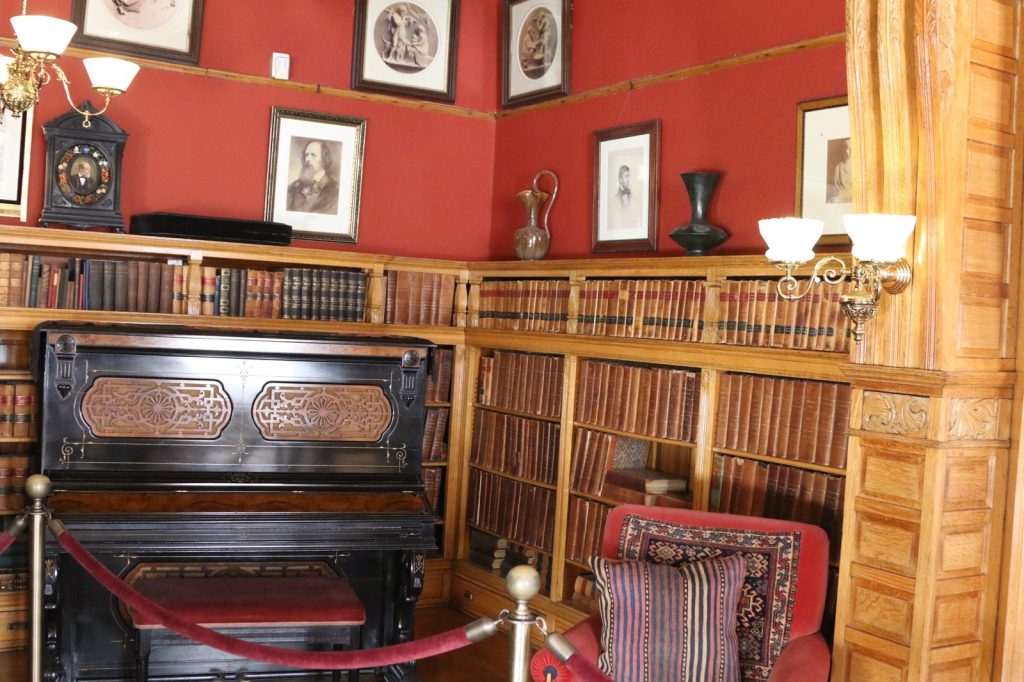 Memorial library interior with piano and bookshelves at Lawnfield James A. Garfield NHS