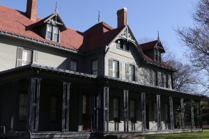 Front exterior of house showing the wrap-around porch and Victorian architecture