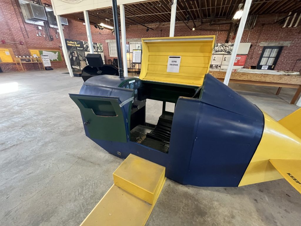 Link Trainer early flight simulator on display in Hangar 2 at Tuskegee Airmen National Historic Site
