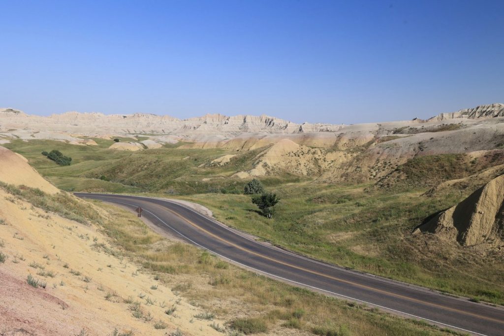 Badlands Loop Road winding through colorful eroded formations and grasslands