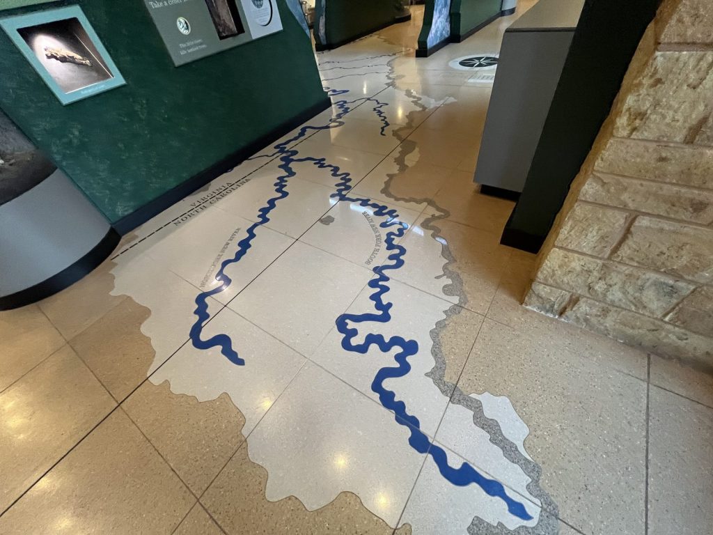 Close-up of New River watershed map inlaid in the tile floor of the New River Gorge visitor center