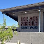 Exterior sign for Ice Age Fossils State Park in North Las Vegas Nevada with animal silhouettes on the building