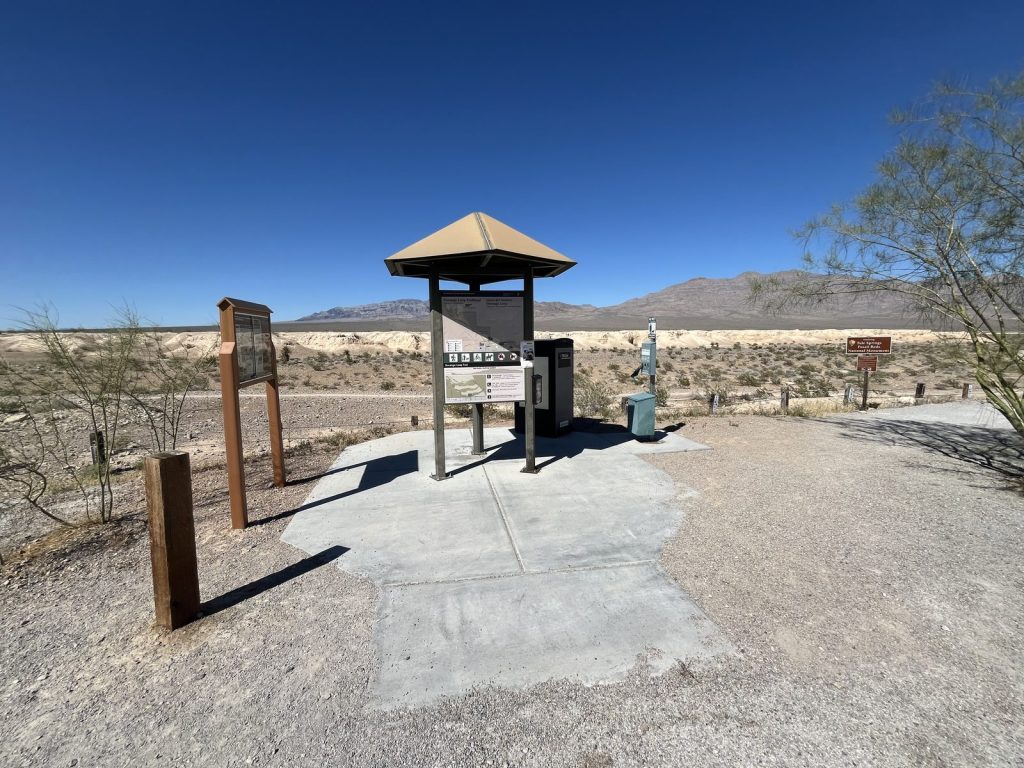 Tule Springs Fossil Beds National Monument Durango Loop trailhead with information kiosk and desert badlands in the background