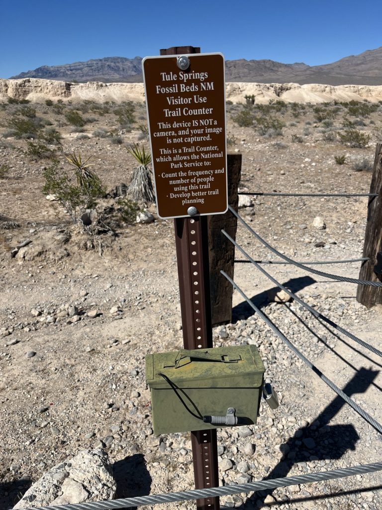 PS visitor use trail counter with sign clarifying this device is not a camera at Tule Springs Fossil Beds National Monument